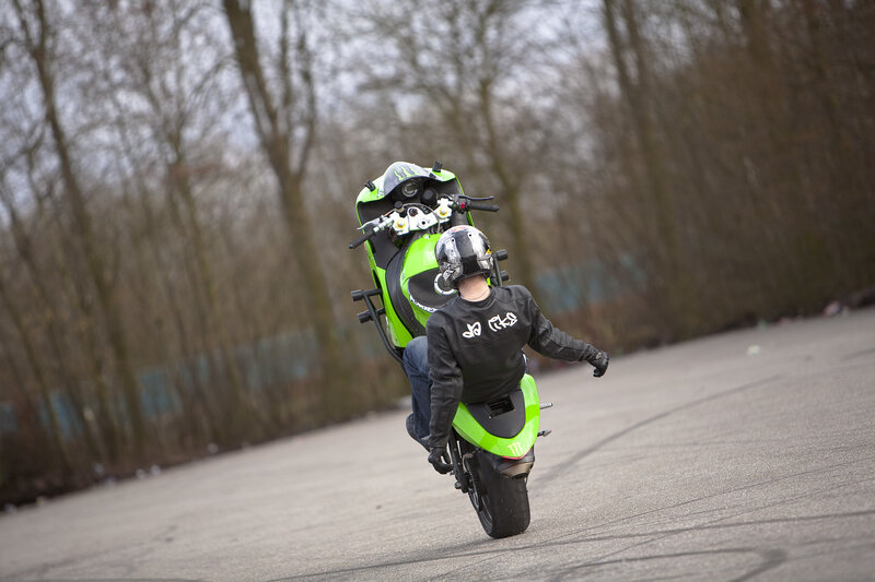 motorcycle wheelie on asphalt