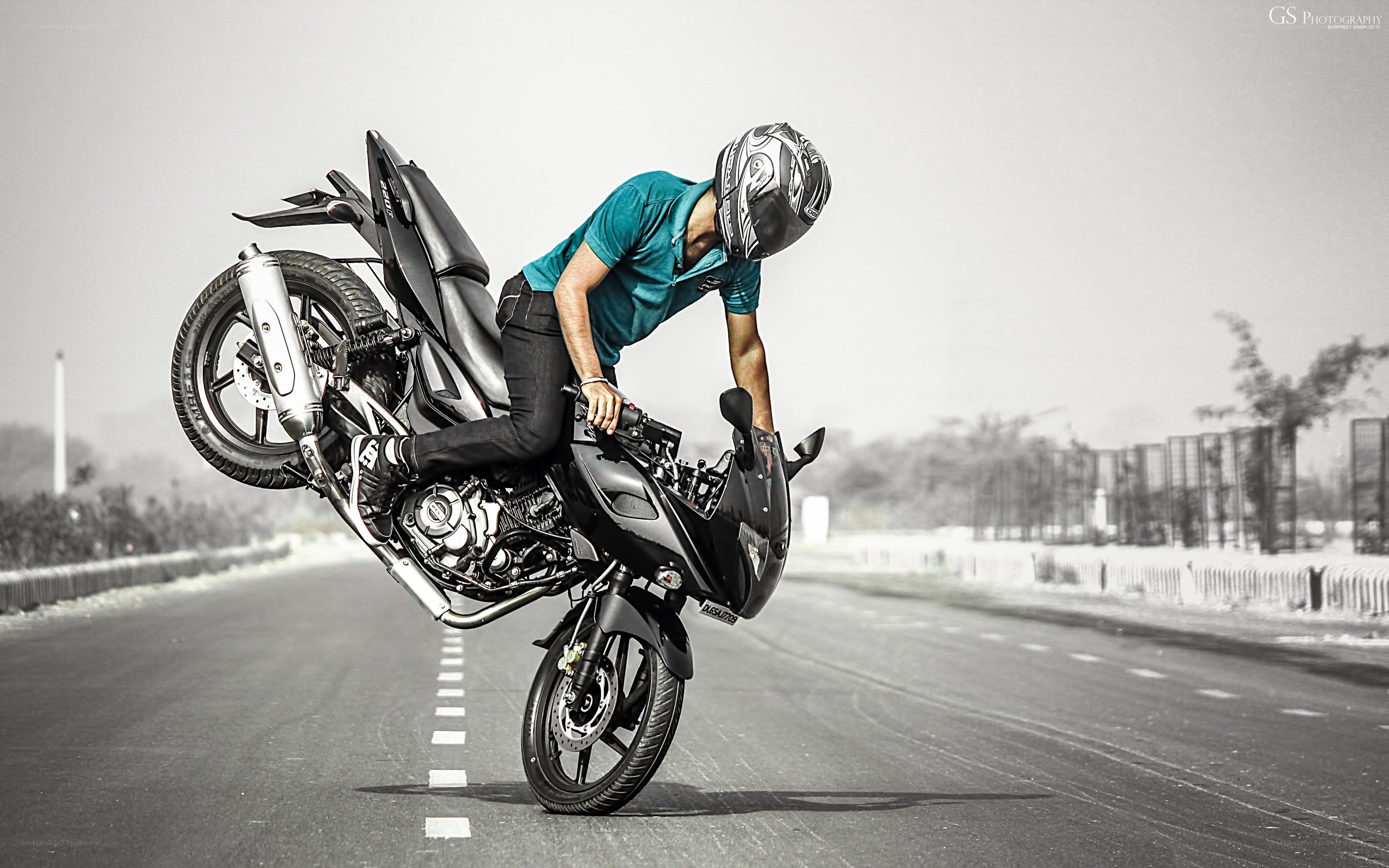 motorcycle wheelie on road