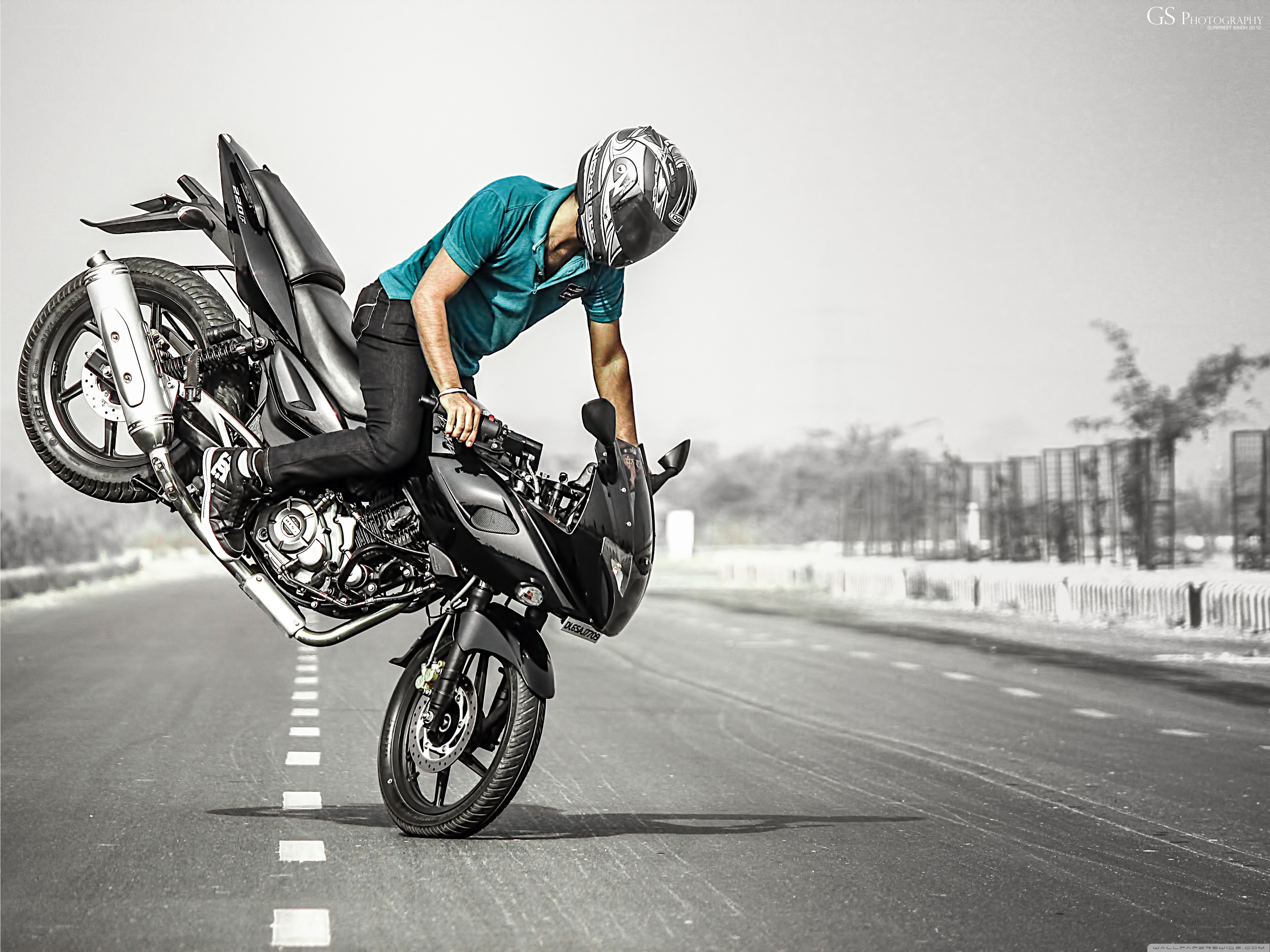 Motorcycle wheelie on road