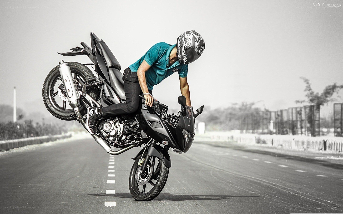 motorcycle wheelie on road