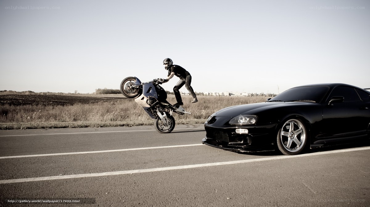 motorcycle wheelie on road
