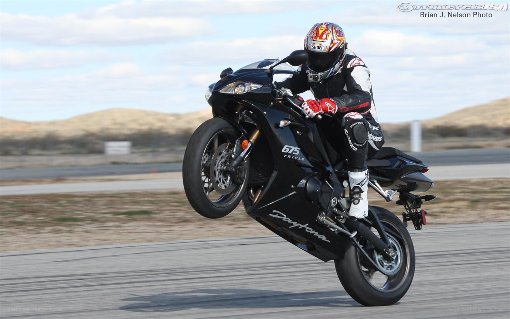 motorcycle wheelie on track