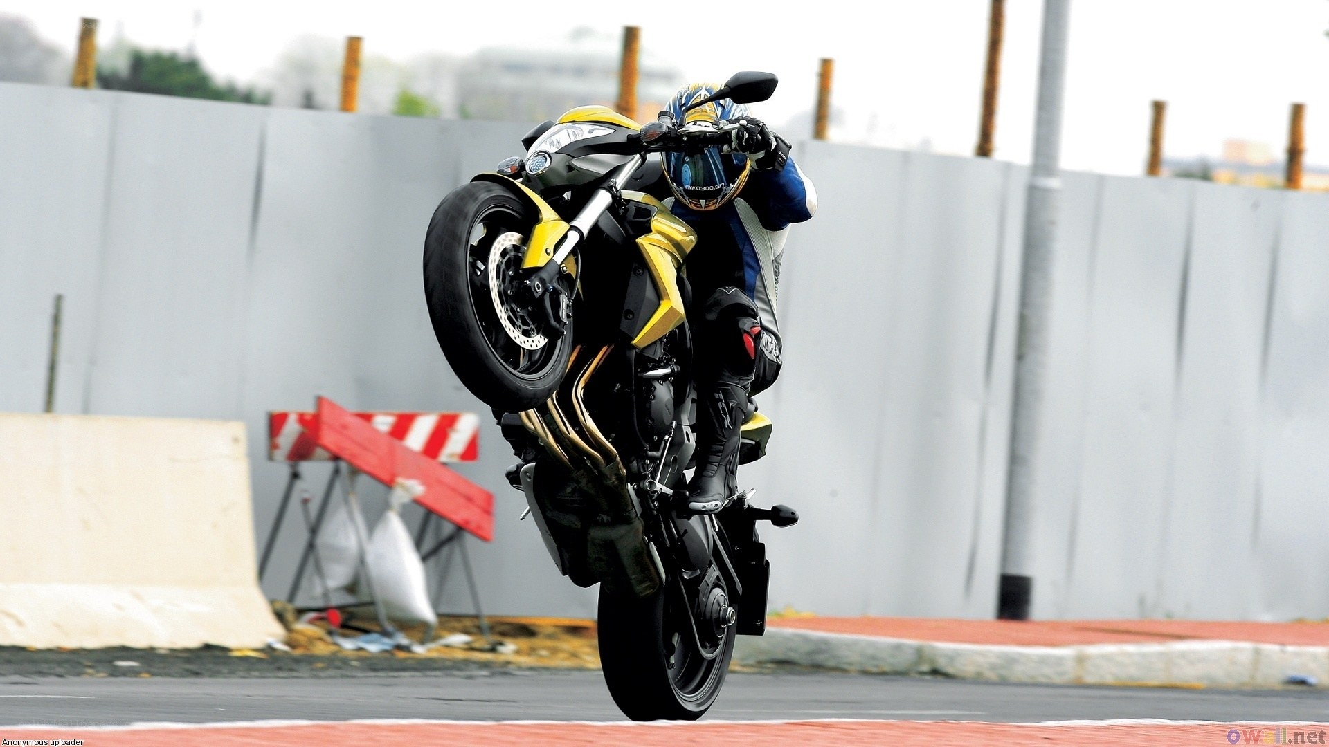 motorcycle wheelie on track