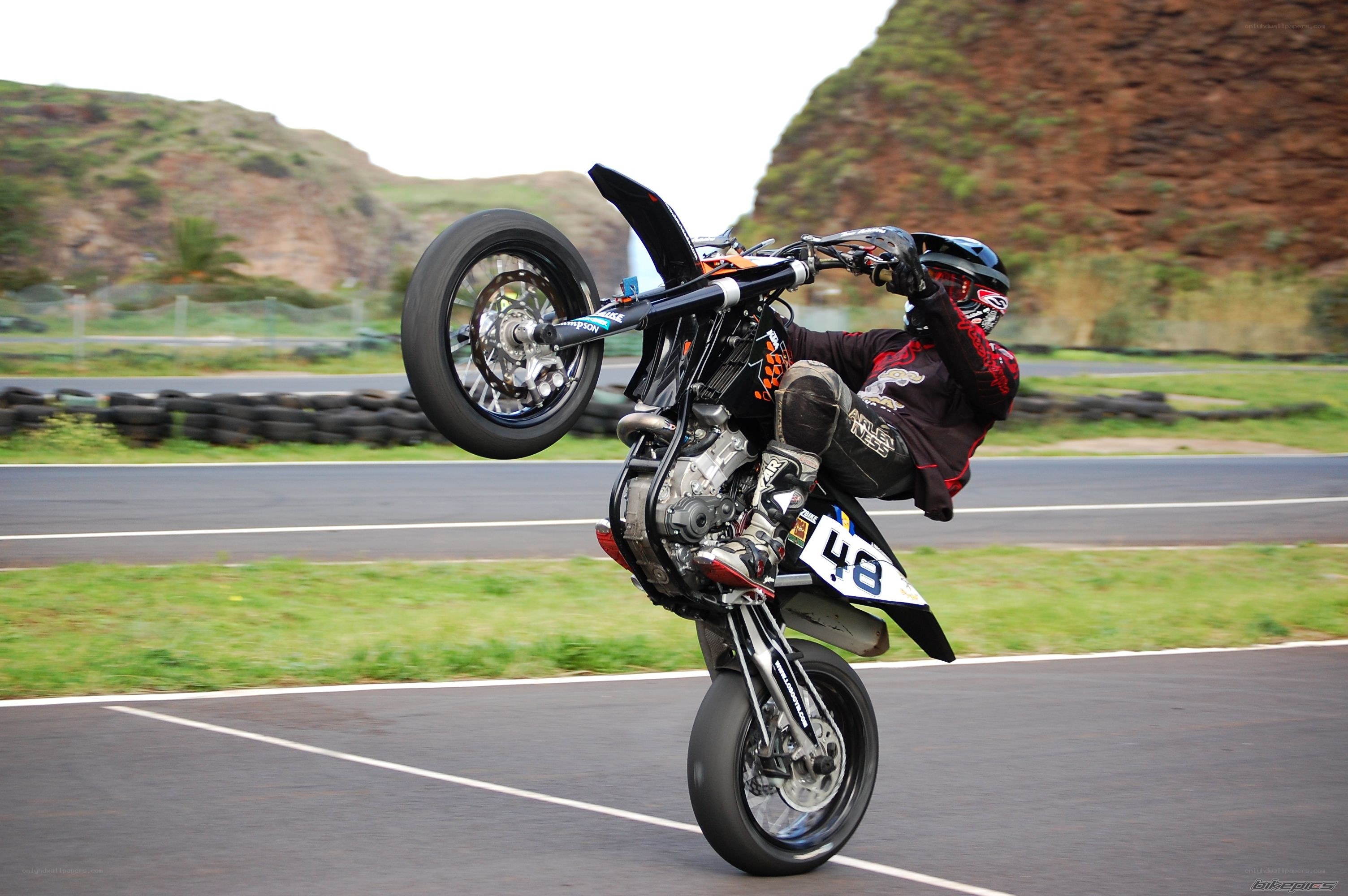 motorcycle wheelie on track
