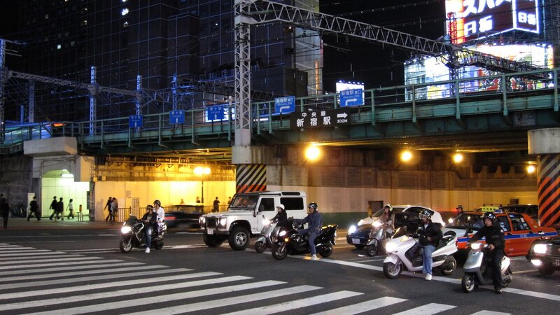 Motorcycles at Night Intersection