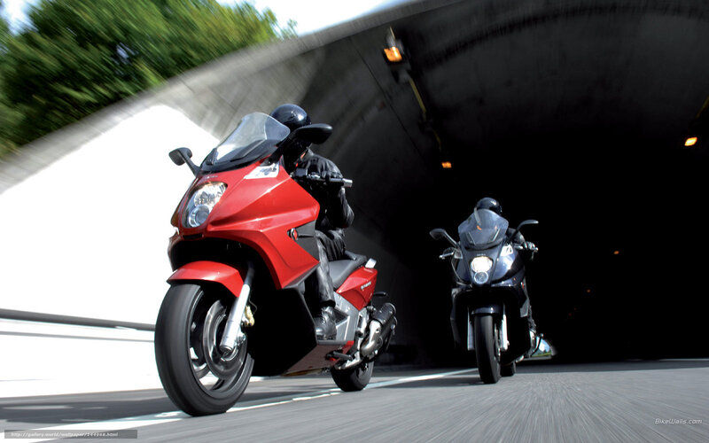 Motorcycles exiting tunnel