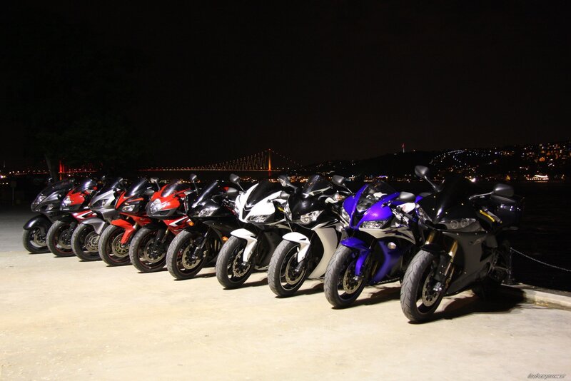 Motorcycles lined up at night