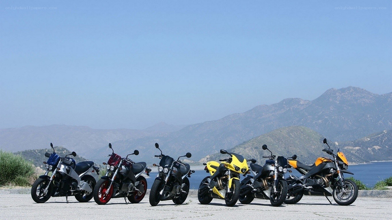 Motorcycles lined up by the coast