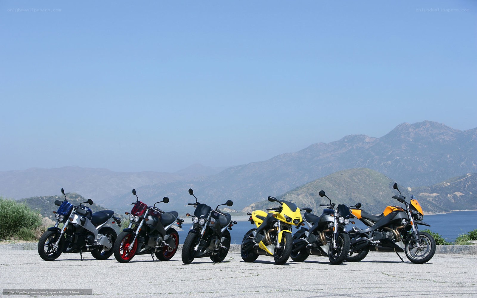 Motorcycles lined up by the coast