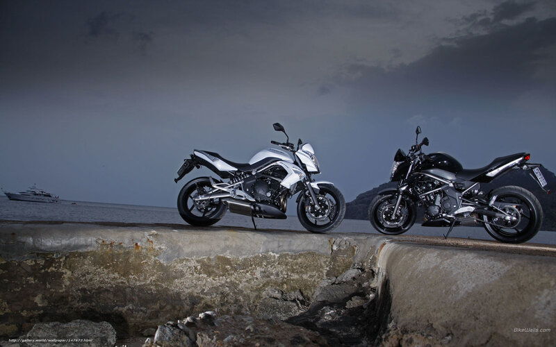 Motorcycles on a pier at dusk