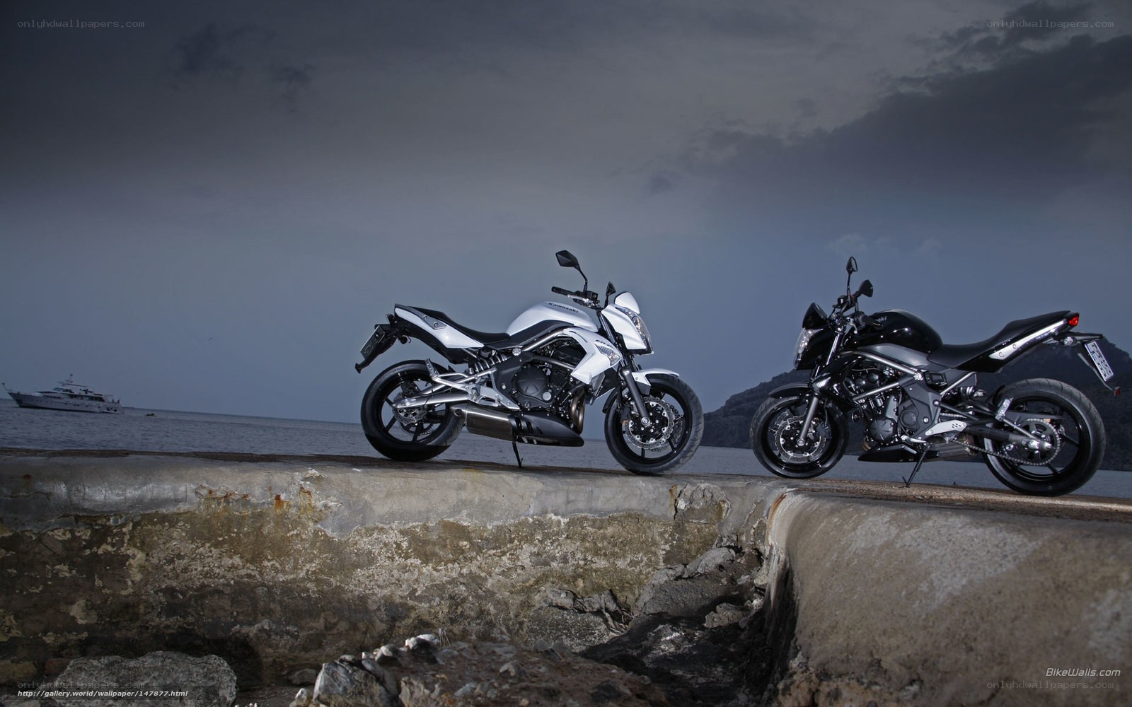 Motorcycles on a pier at dusk
