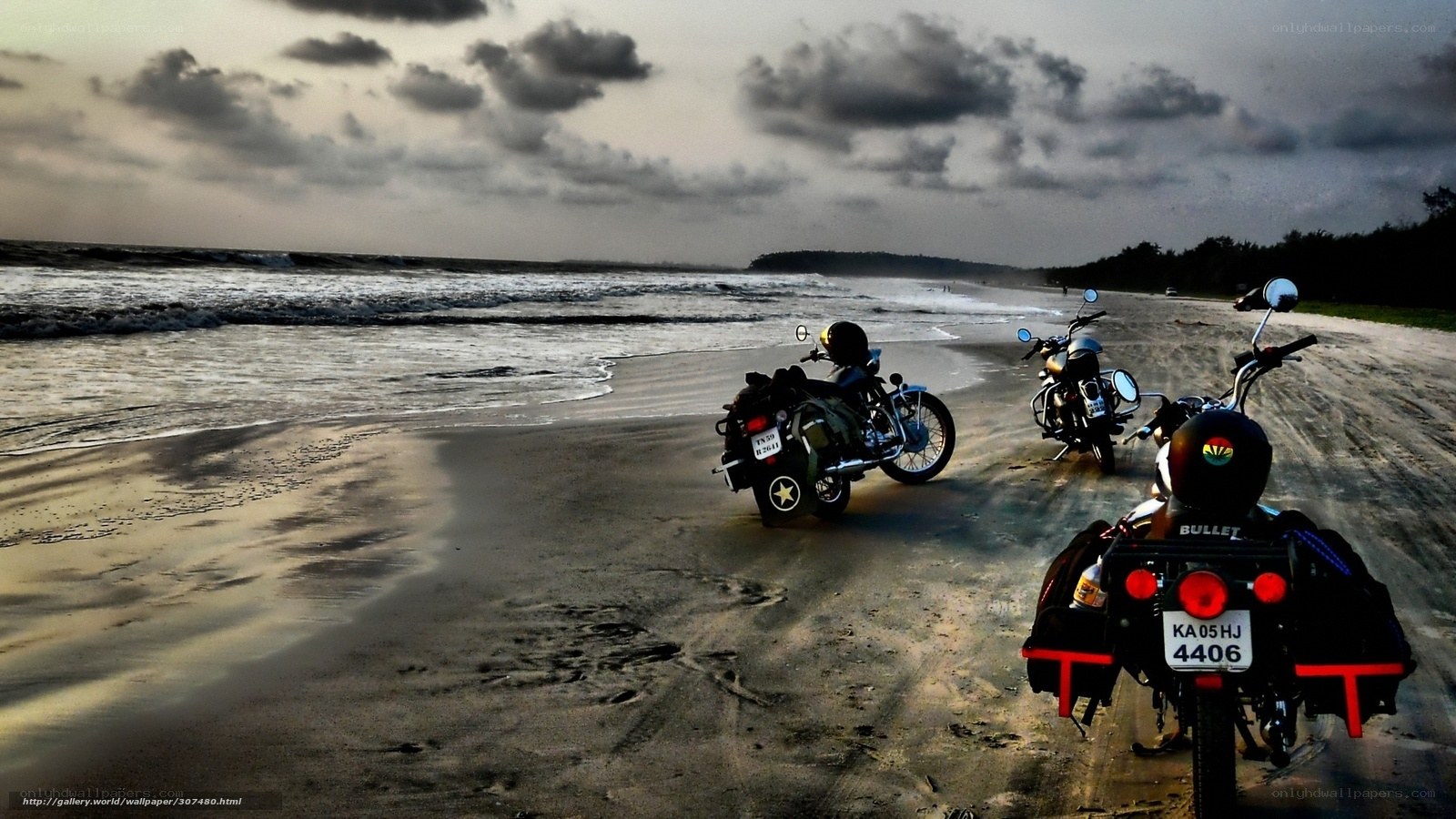 Motorcycles on the beach at sunset