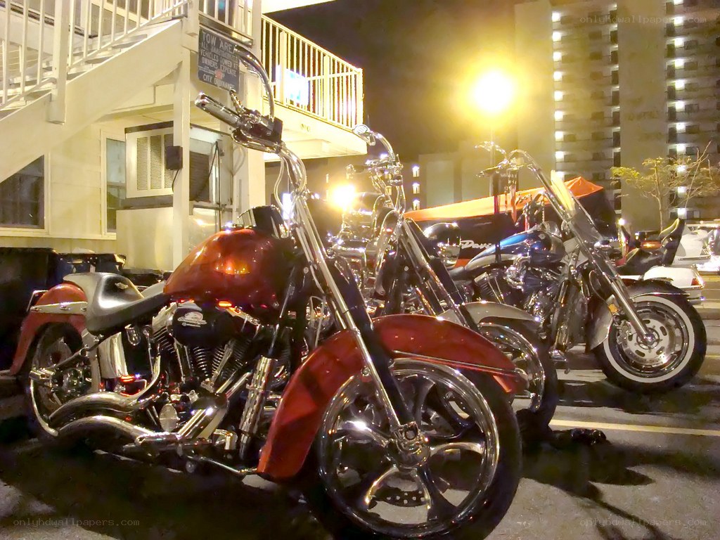 Motorcycles parked at night