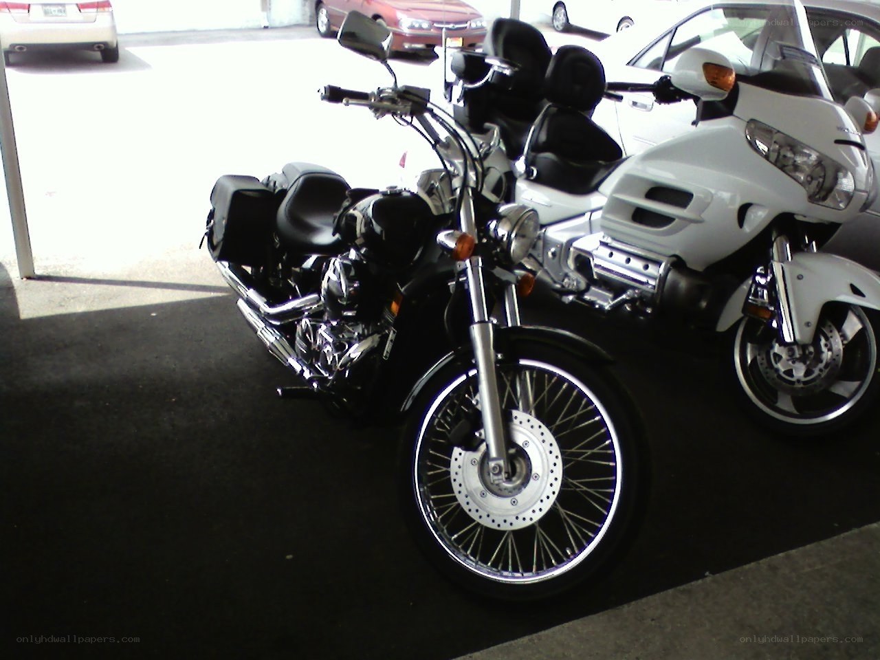 Motorcycles parked in a garage