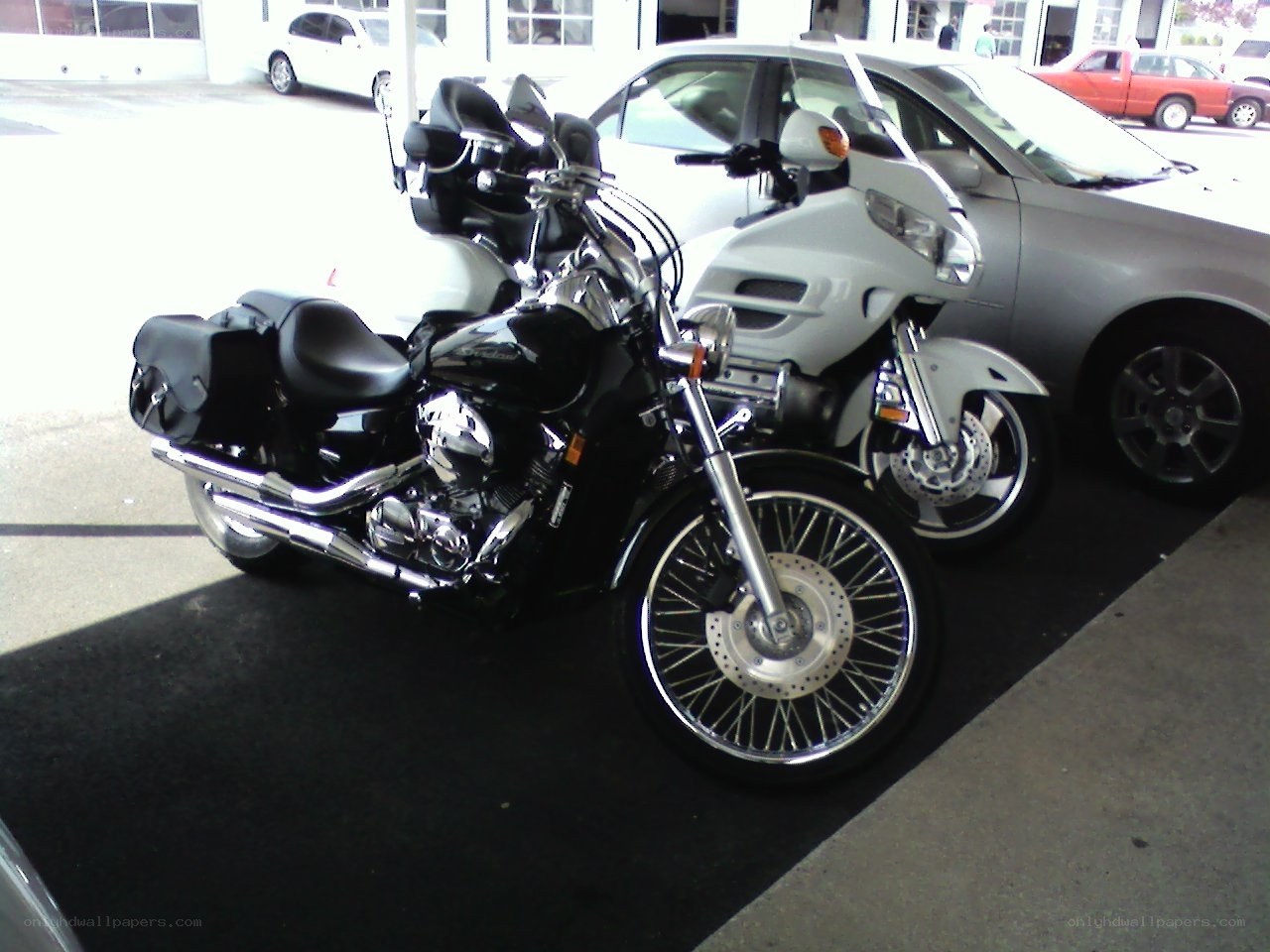 Motorcycles parked in a lot