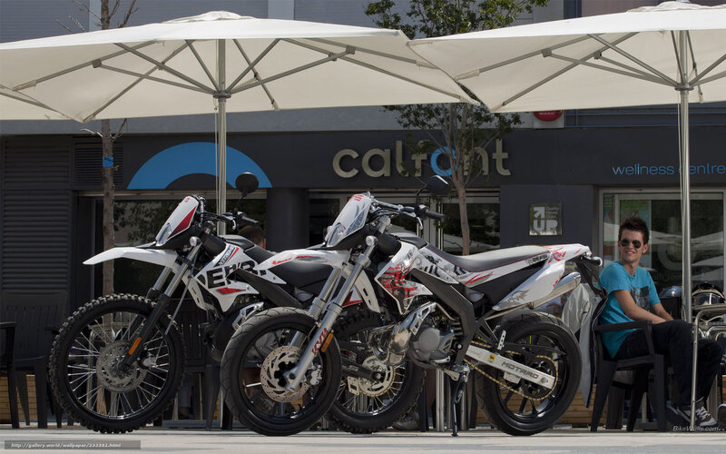 Motorcycles under umbrellas