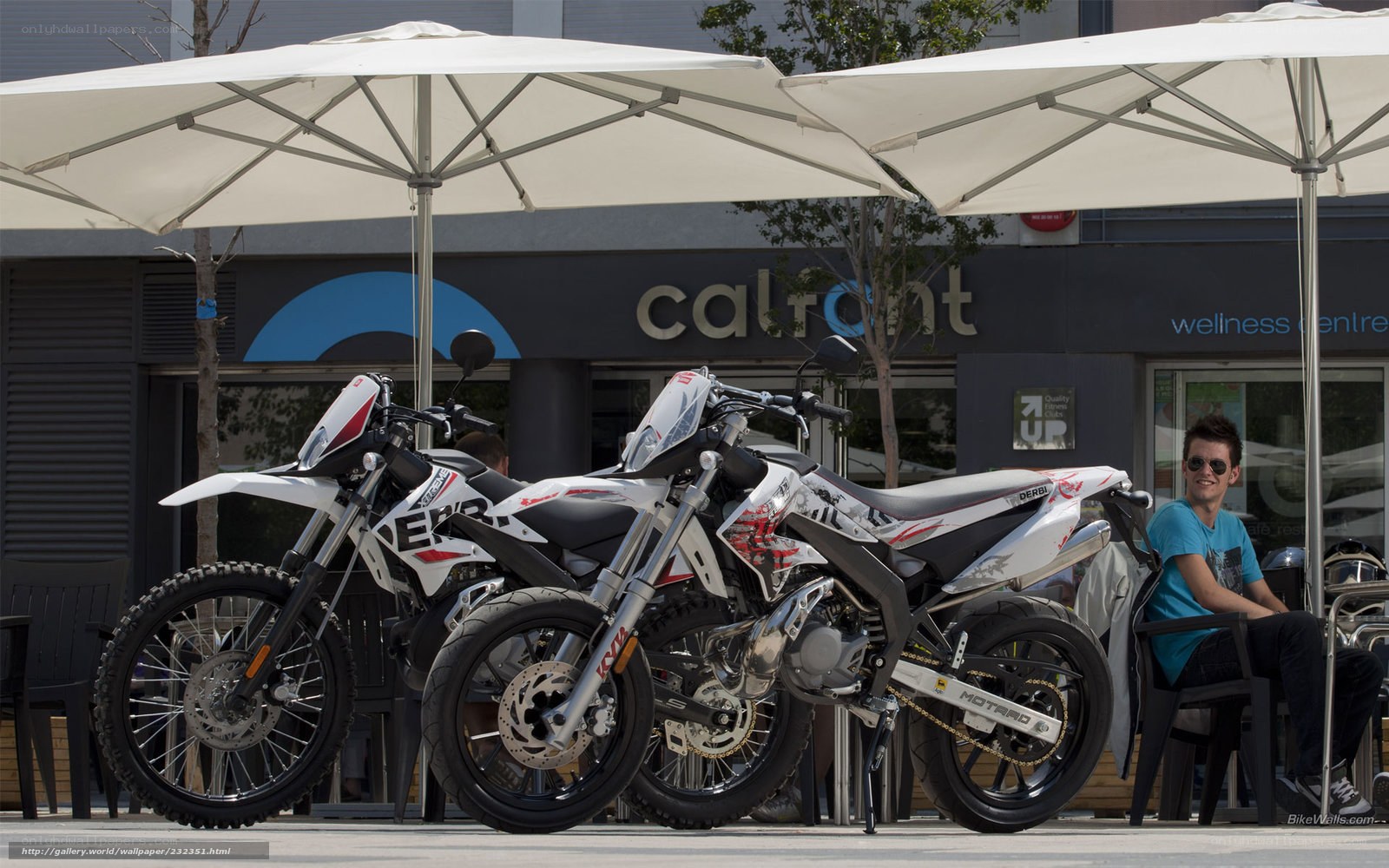 Motorcycles under umbrellas