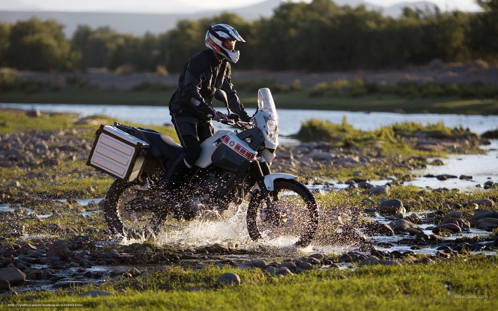 motorcyclist crossing a river
