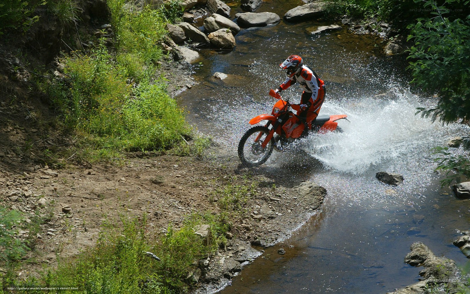motorcyclist crossing a stream