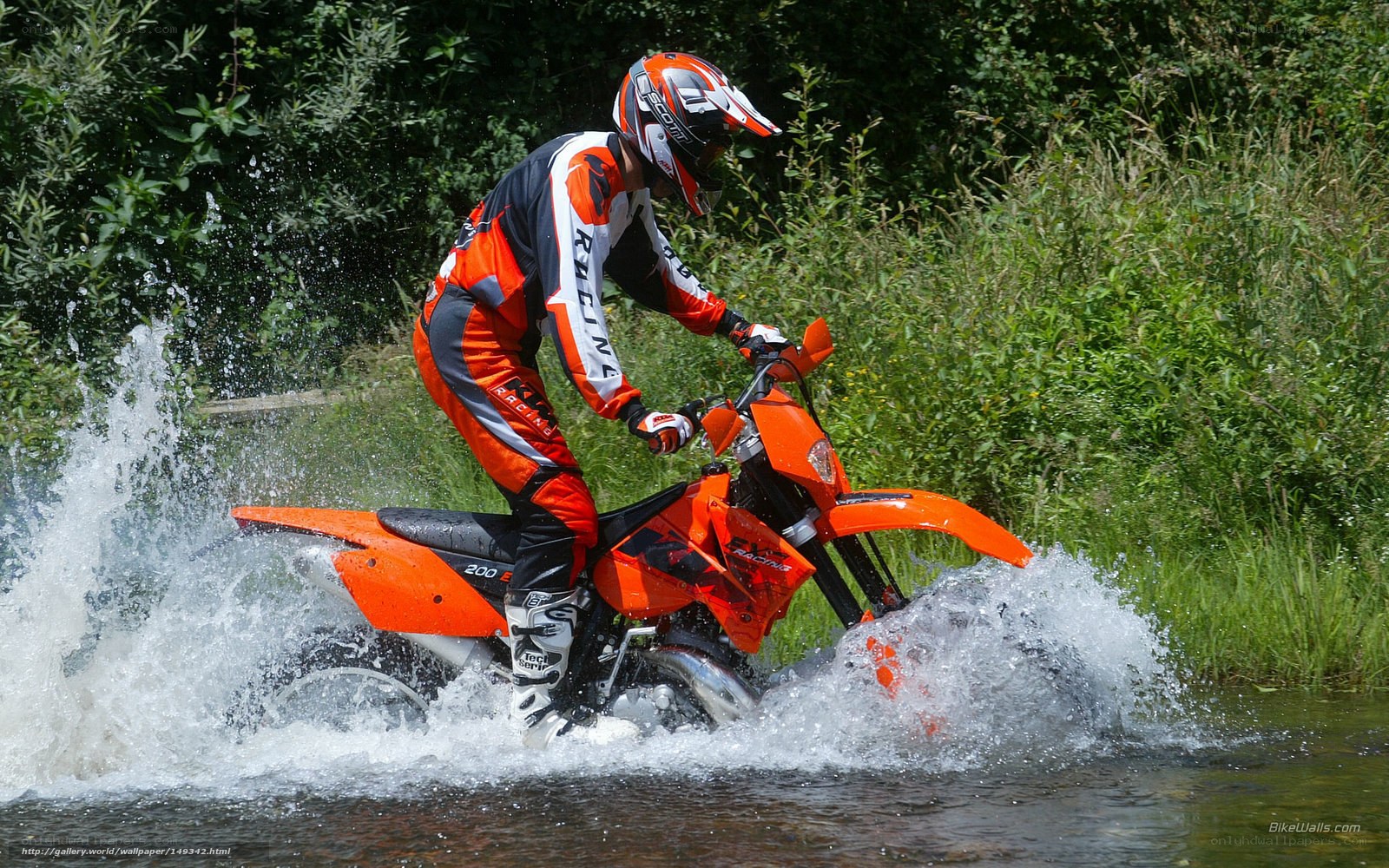 Motorcyclist crossing a stream