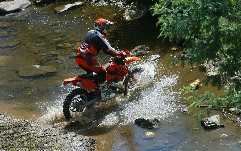 Motorcyclist Crossing Stream — Orange