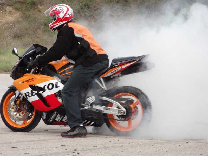 Motorcyclist Doing Burnout — Orange