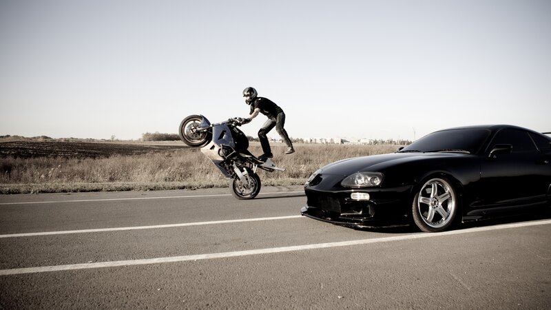 Motorcyclist Doing Wheelie — Black, Dramatic, Afternoon, Photograph, Car, Road, Field