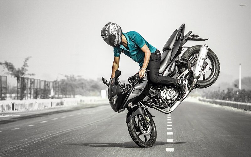 Motorcyclist Doing Wheelie — Black, Dramatic, Afternoon