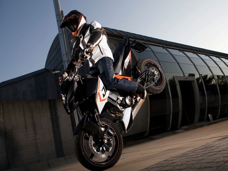 Motorcyclist Doing Wheelie — Black, Dynamic, Afternoon, Photograph