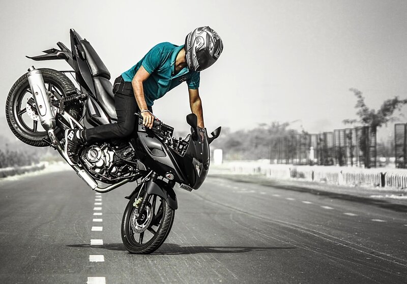 Motorcyclist Doing Wheelie — Black