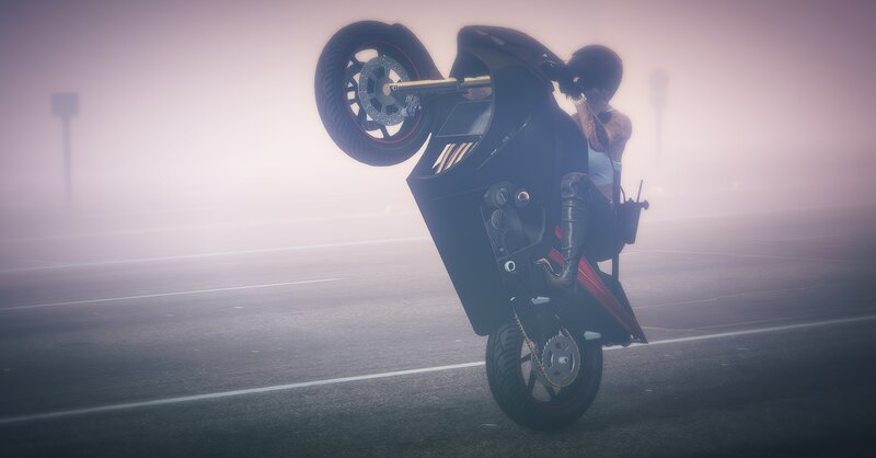 Motorcyclist Doing Wheelie — Gray, Misty