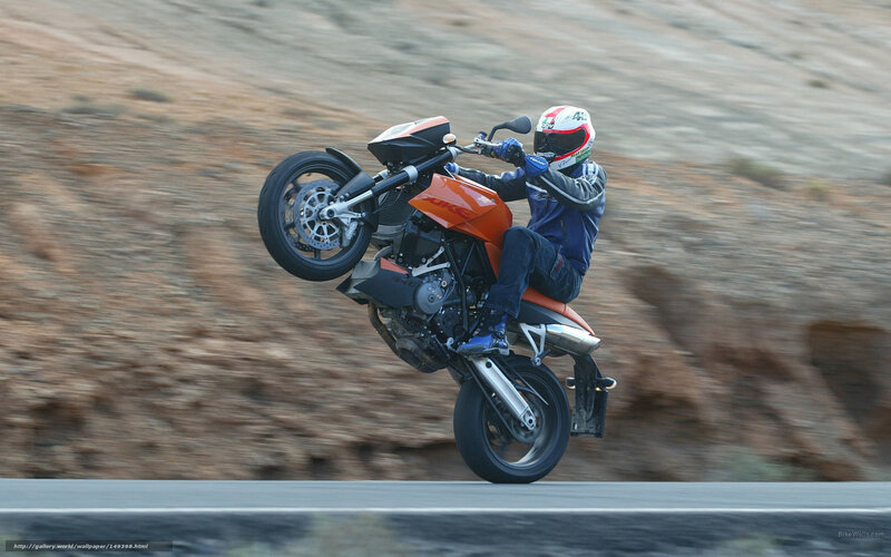 Motorcyclist Doing Wheelie — Orange