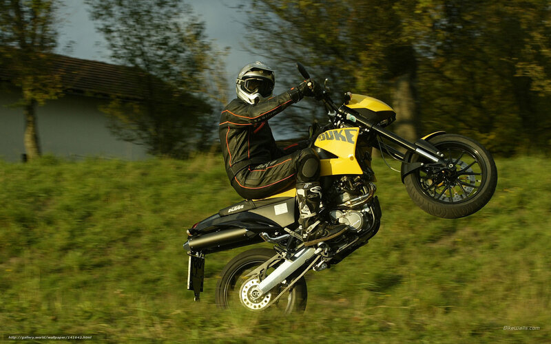 Motorcyclist Doing Wheelie — Yellow