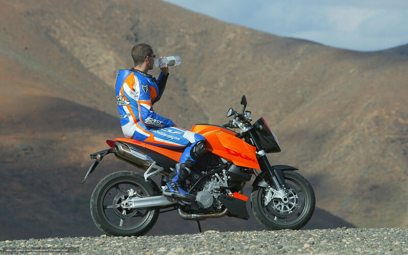 Motorcyclist Drinking Water — Orange