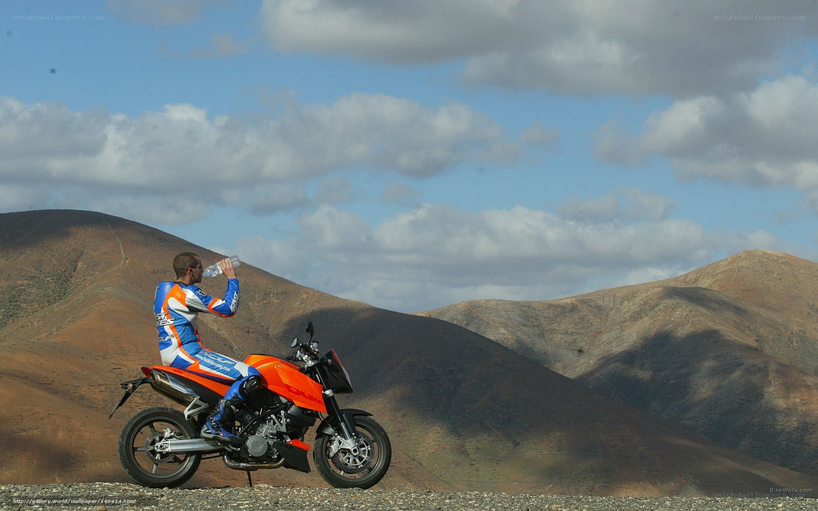 Motorcyclist drinking water