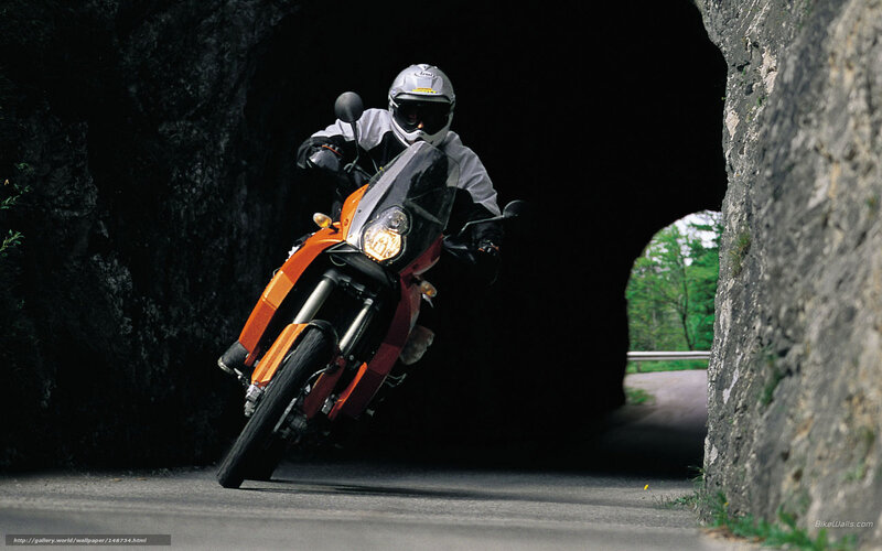 Motorcyclist exiting tunnel