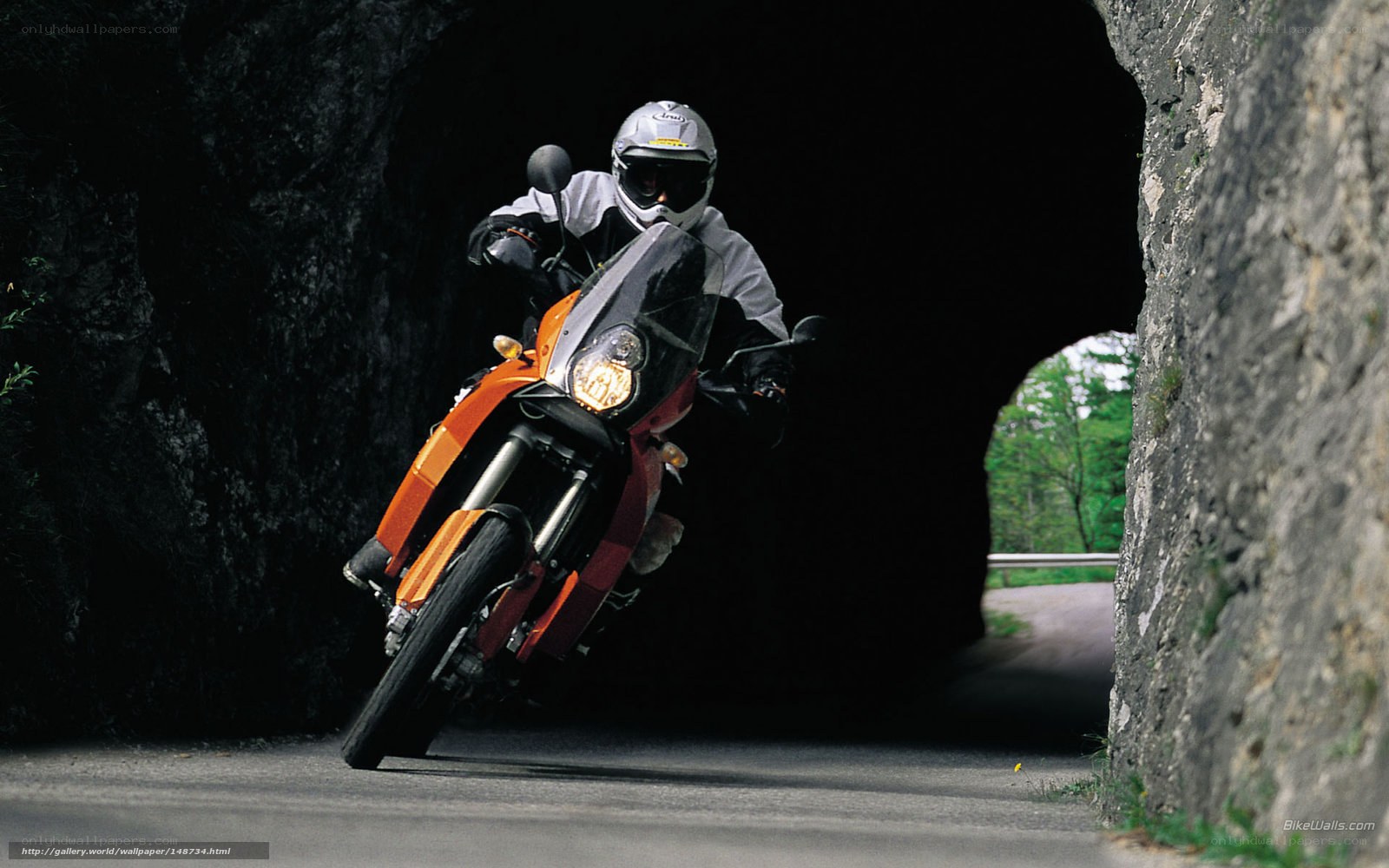 Motorcyclist exiting tunnel