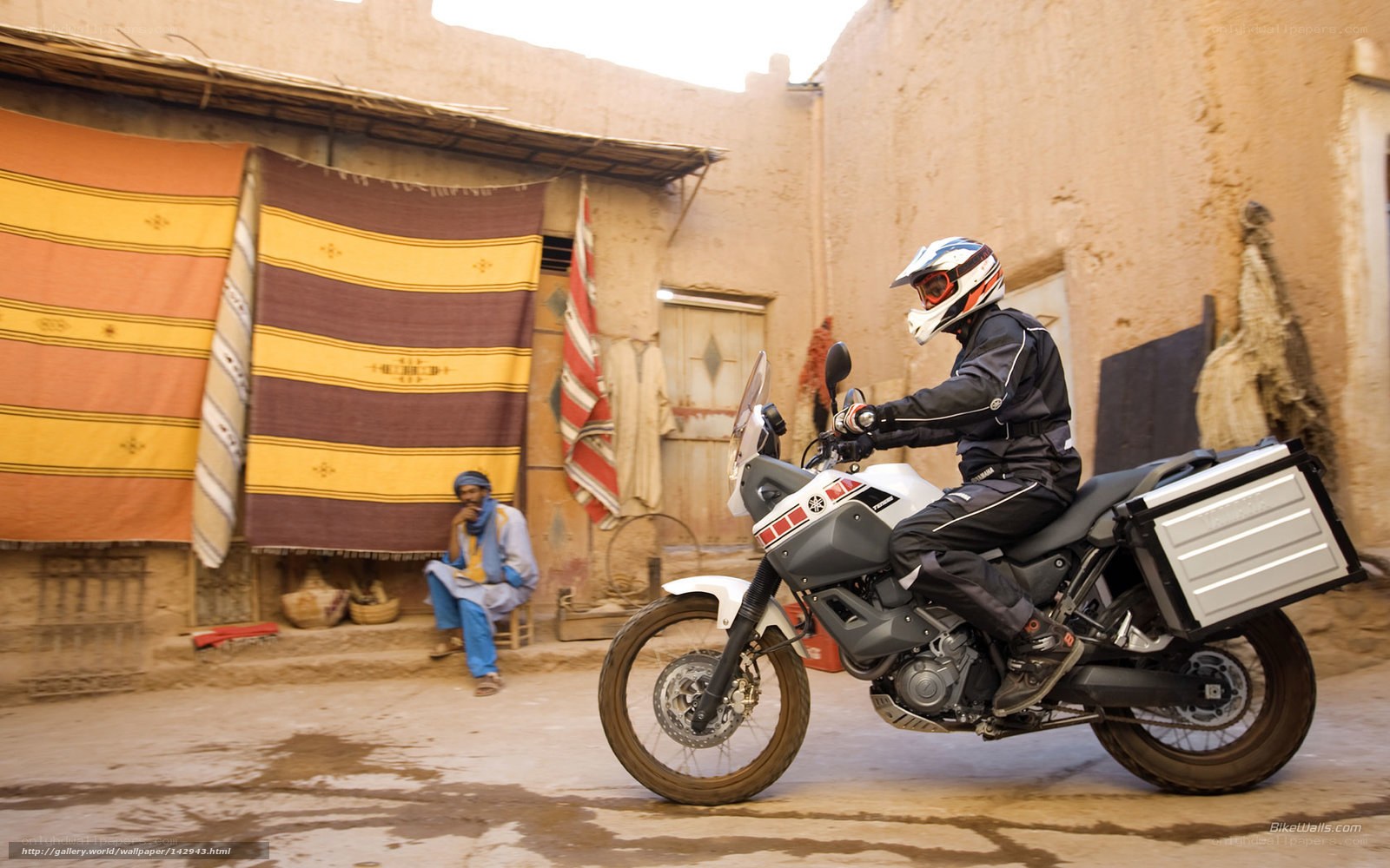 Motorcyclist in a village