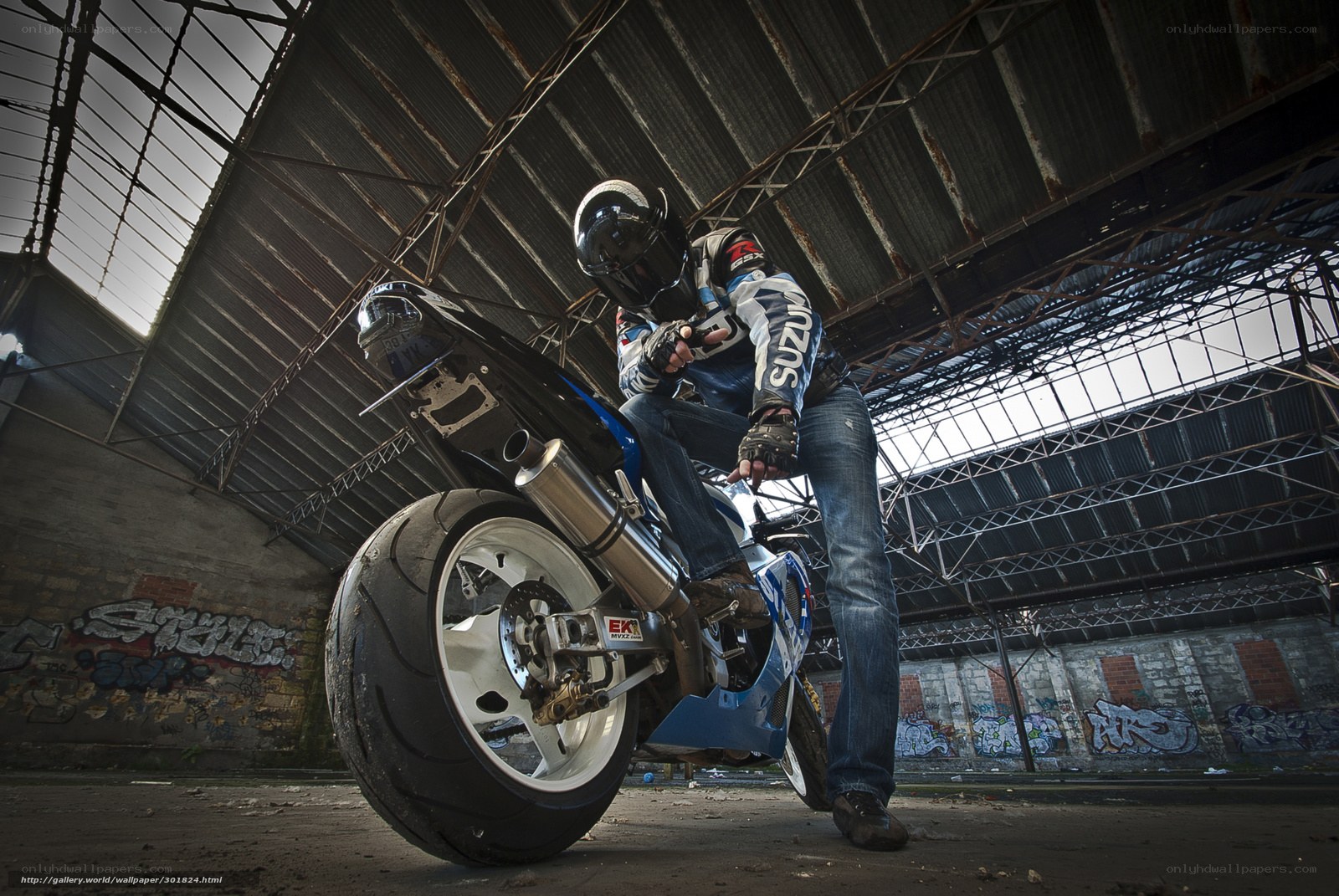Motorcyclist in abandoned warehouse