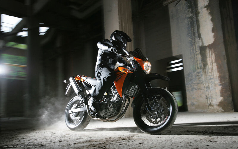Motorcyclist in industrial setting