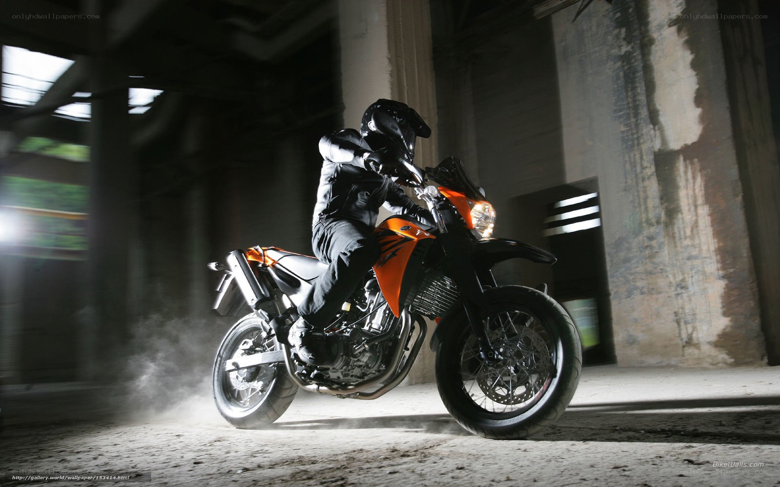 Motorcyclist in industrial setting