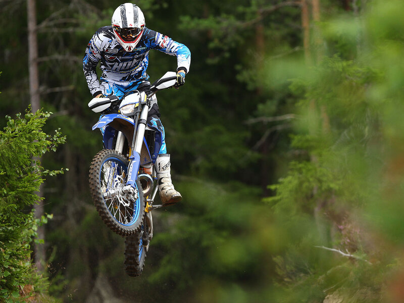 Motorcyclist in Mid-air — Blue