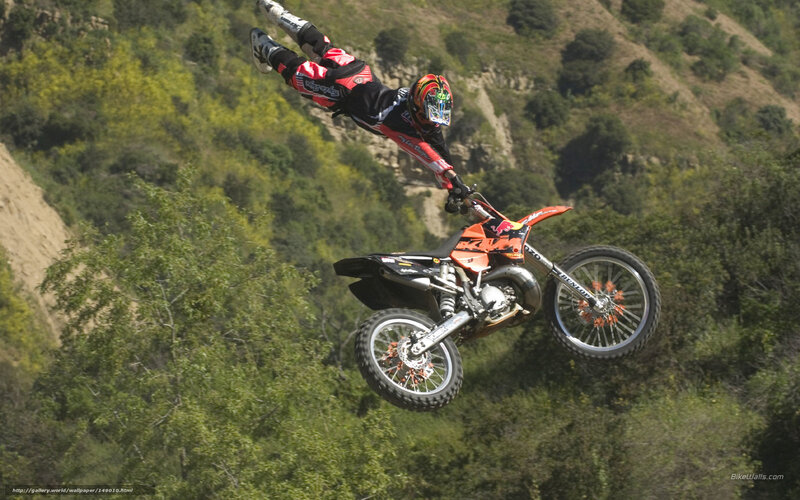 Motorcyclist in Mid-air — Orange, Dramatic