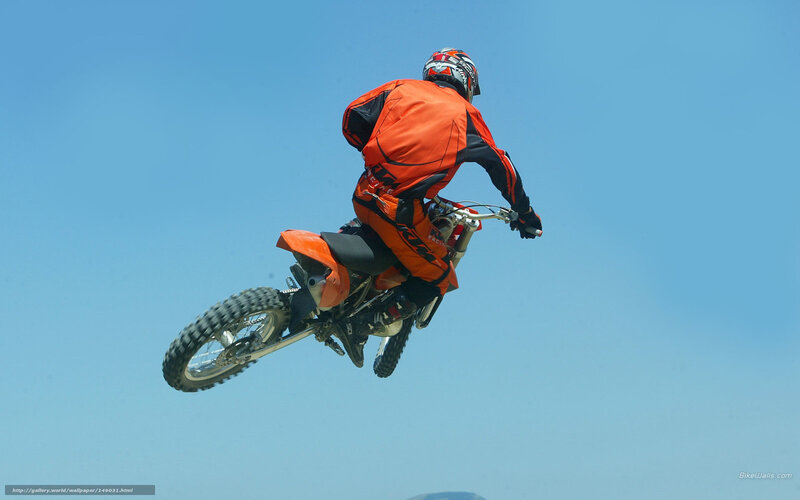 Motorcyclist in Mid-air — Orange, Dynamic, Afternoon
