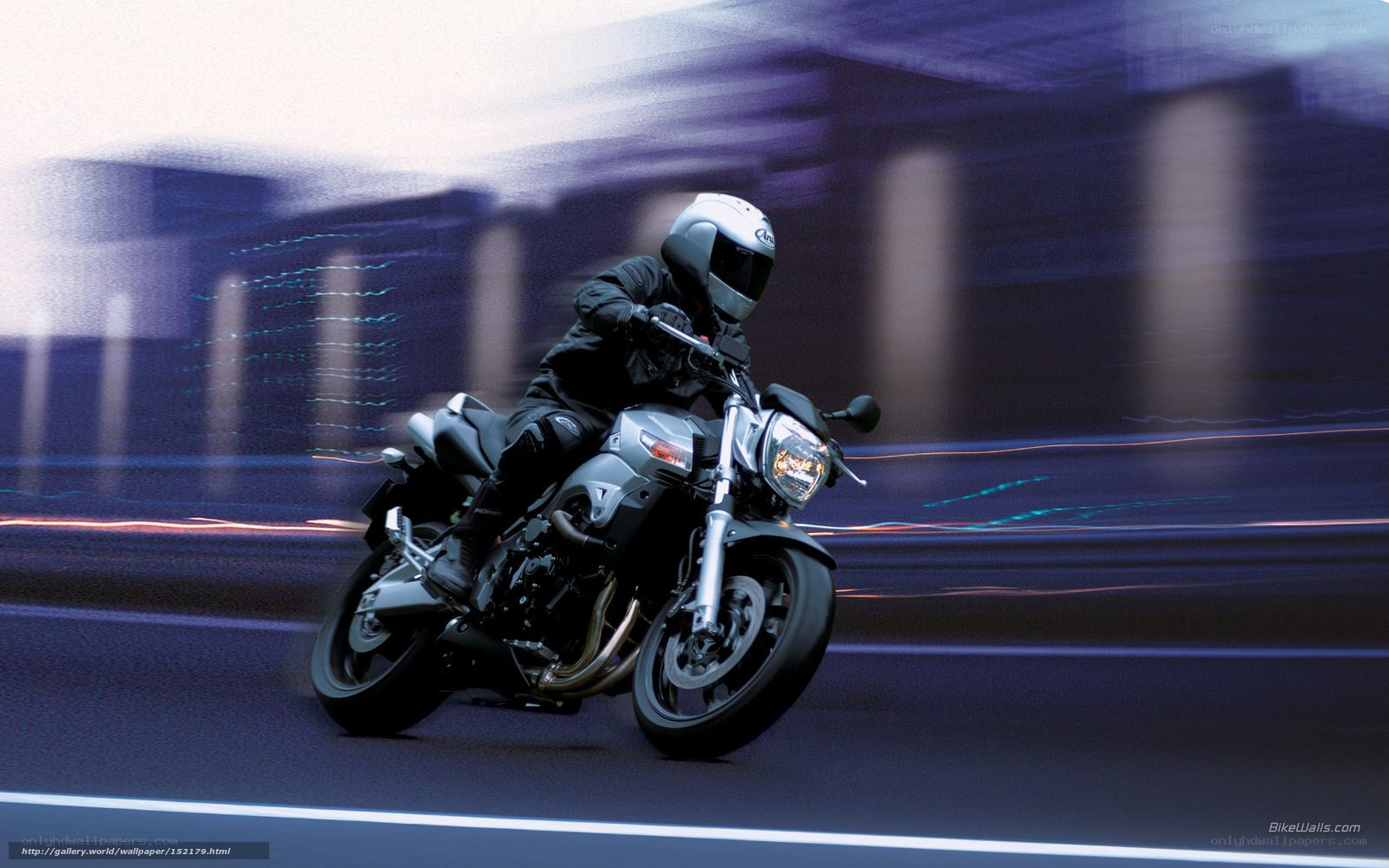 motorcyclist in motion at night