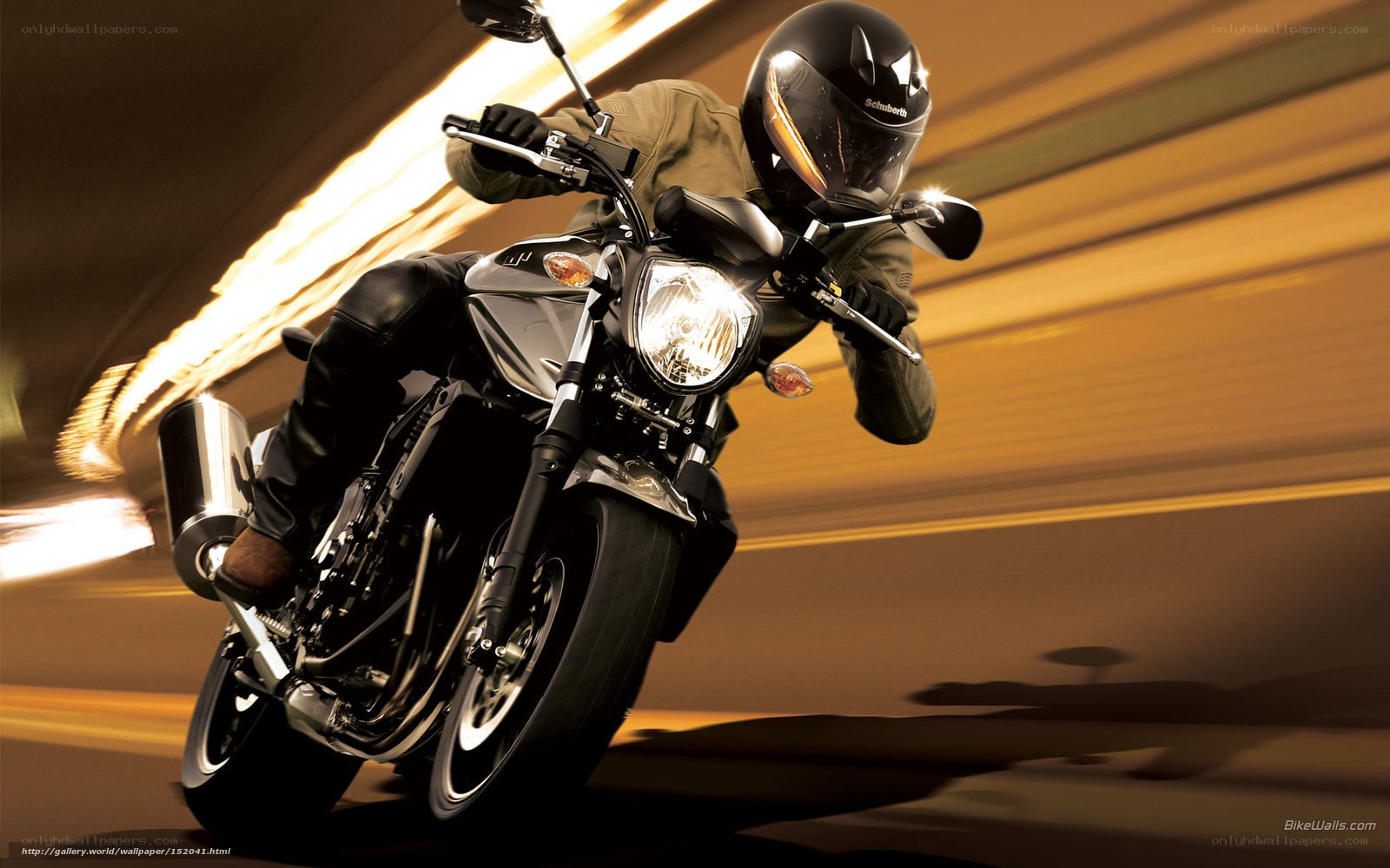 Motorcyclist in motion at night