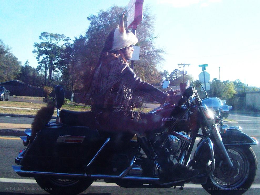 motorcyclist in traditional attire