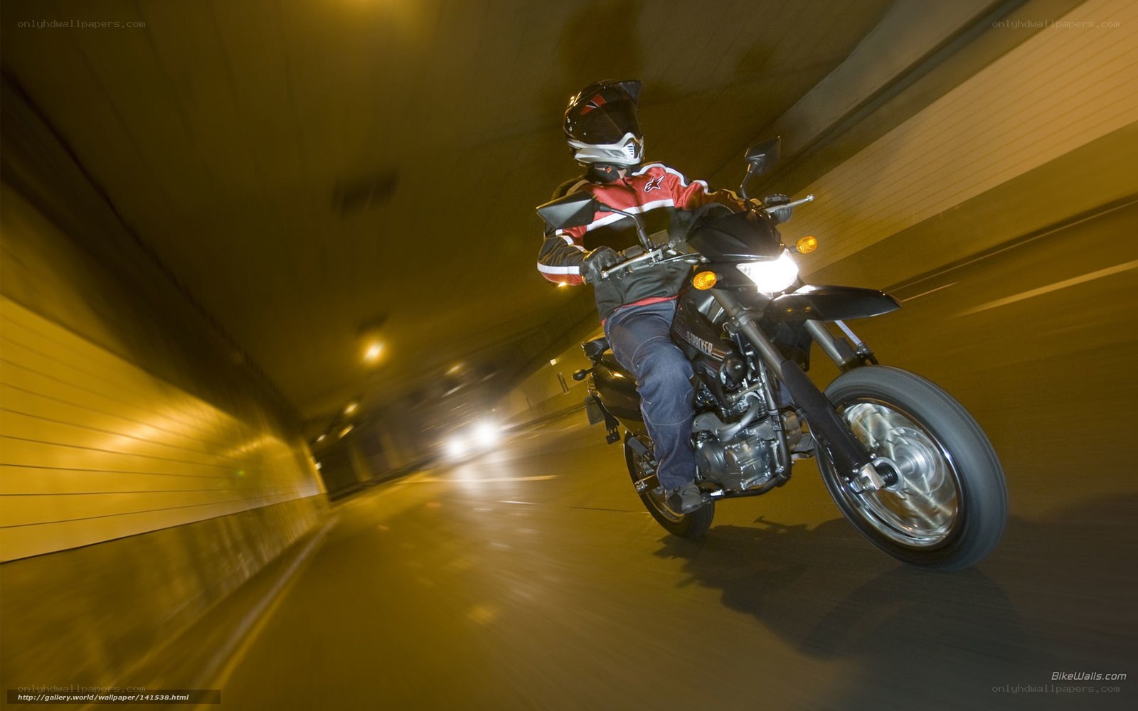 Motorcyclist in tunnel at night