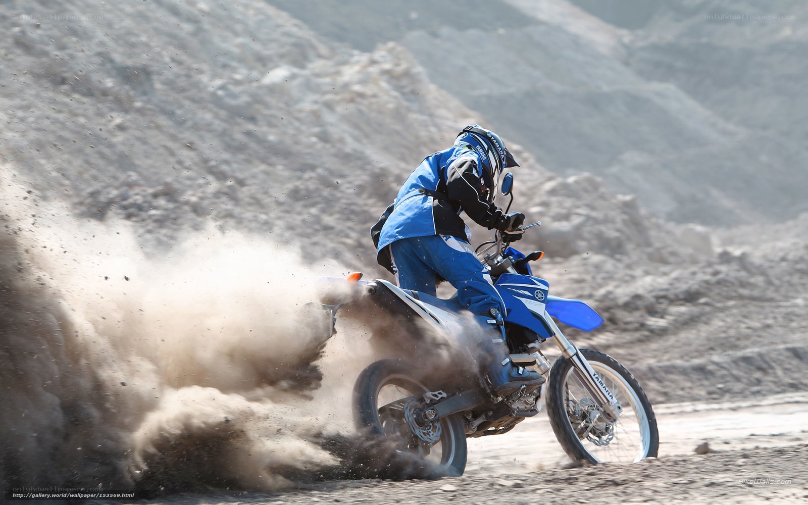 Motorcyclist kicking up dust