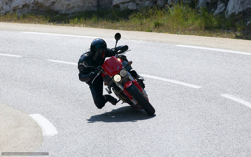 Motorcyclist leaning in a turn